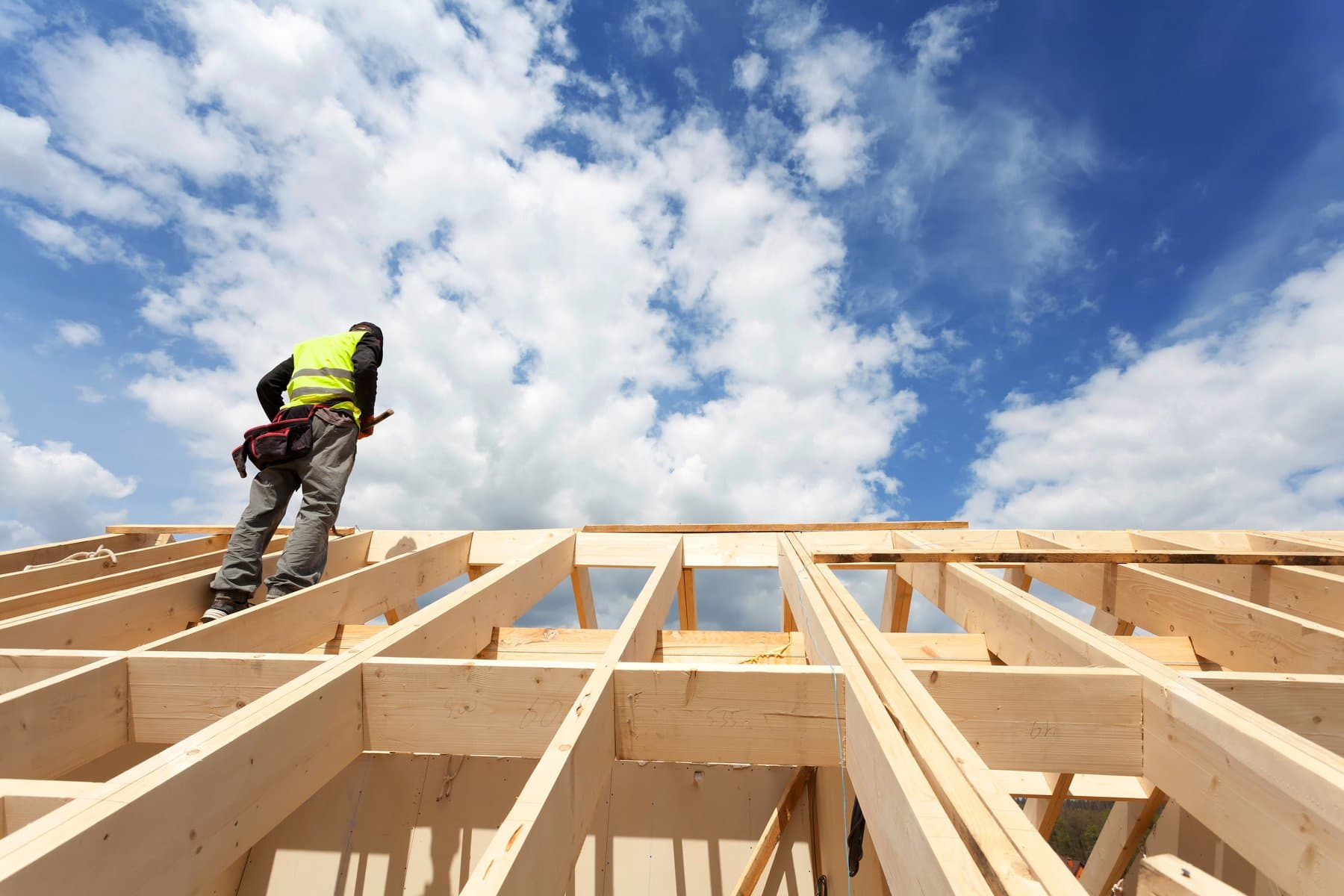 Framing crew on a roof structure