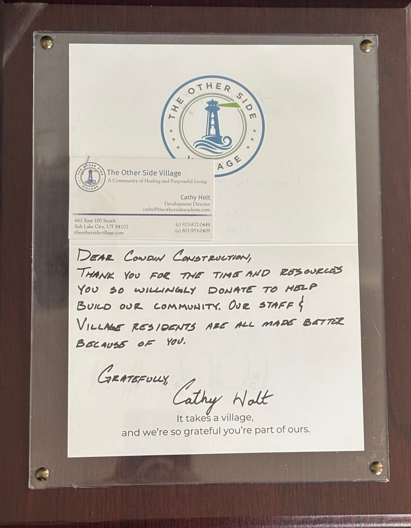 Framed thank-you letter from The Other Side Village
